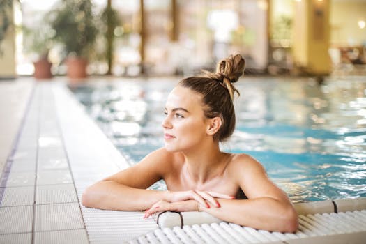 A serene moment as a woman relaxes in a poolside setting at a luxurious resort, enjoying the summer vibes.